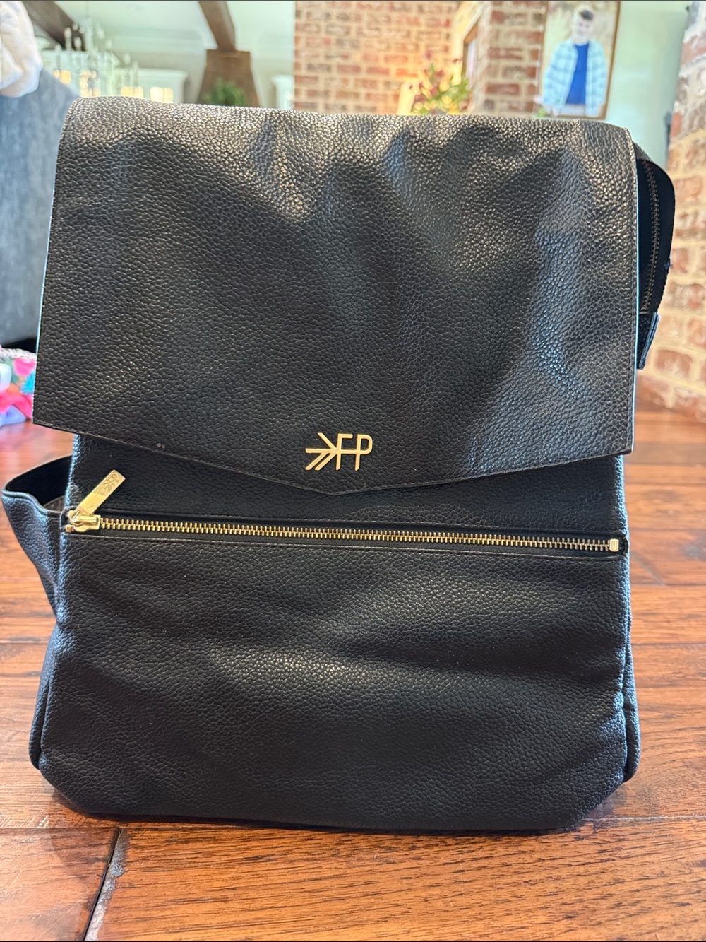 Freshly Picked Black Leather Fold-Top Backpack with Gold Accents